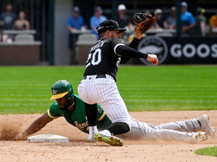 Aug 19, 2021; Chicago, Illinois, USA; Chicago White Sox second baseman Danny Mendick (20) misses the tag on Oakland Athletics center fielder Starling Marte (2) during the fifth inning at Guaranteed Rate Field.